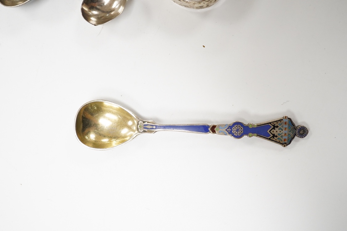 A George III silver pedestal salt, London, 1805, diameter 84mm, together with a pair of Georgian silver sugar tongs, two silver condiment spoons and a Russian 84 zolotnik and polychrome cloisonne enamel spoon, 11.1cm.